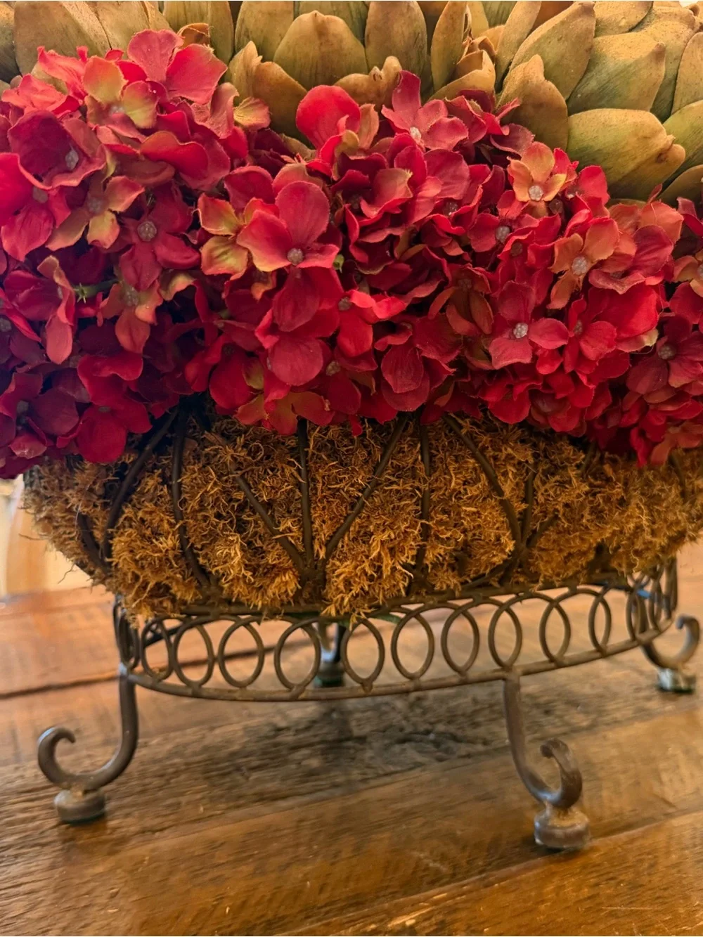 Rustic Iron Basket Centerpiece with Green Artichoke and Red Hydrangea Accents